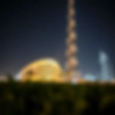 Night view of Burj Al Noor illuminated, highlighting its modern design