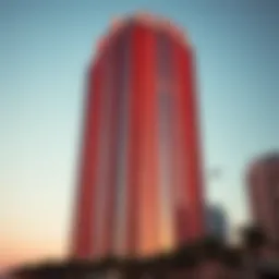 The stunning facade of Marina Gate Tower reflecting the sunset